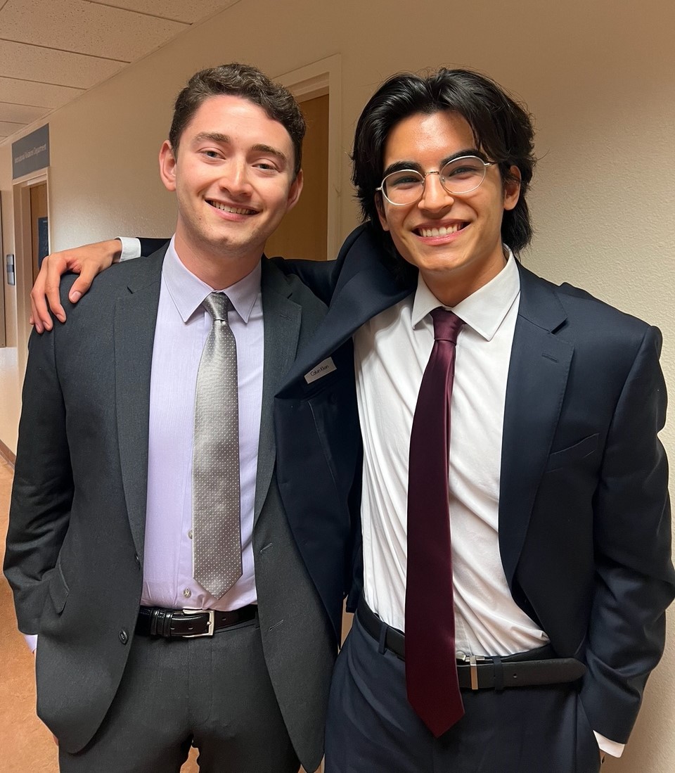 Students celebrating moot court competition advancement